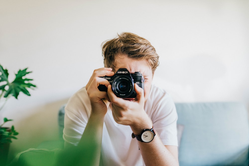 sitting man taking picture