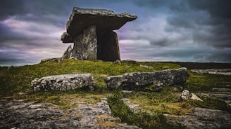stone structure in green field