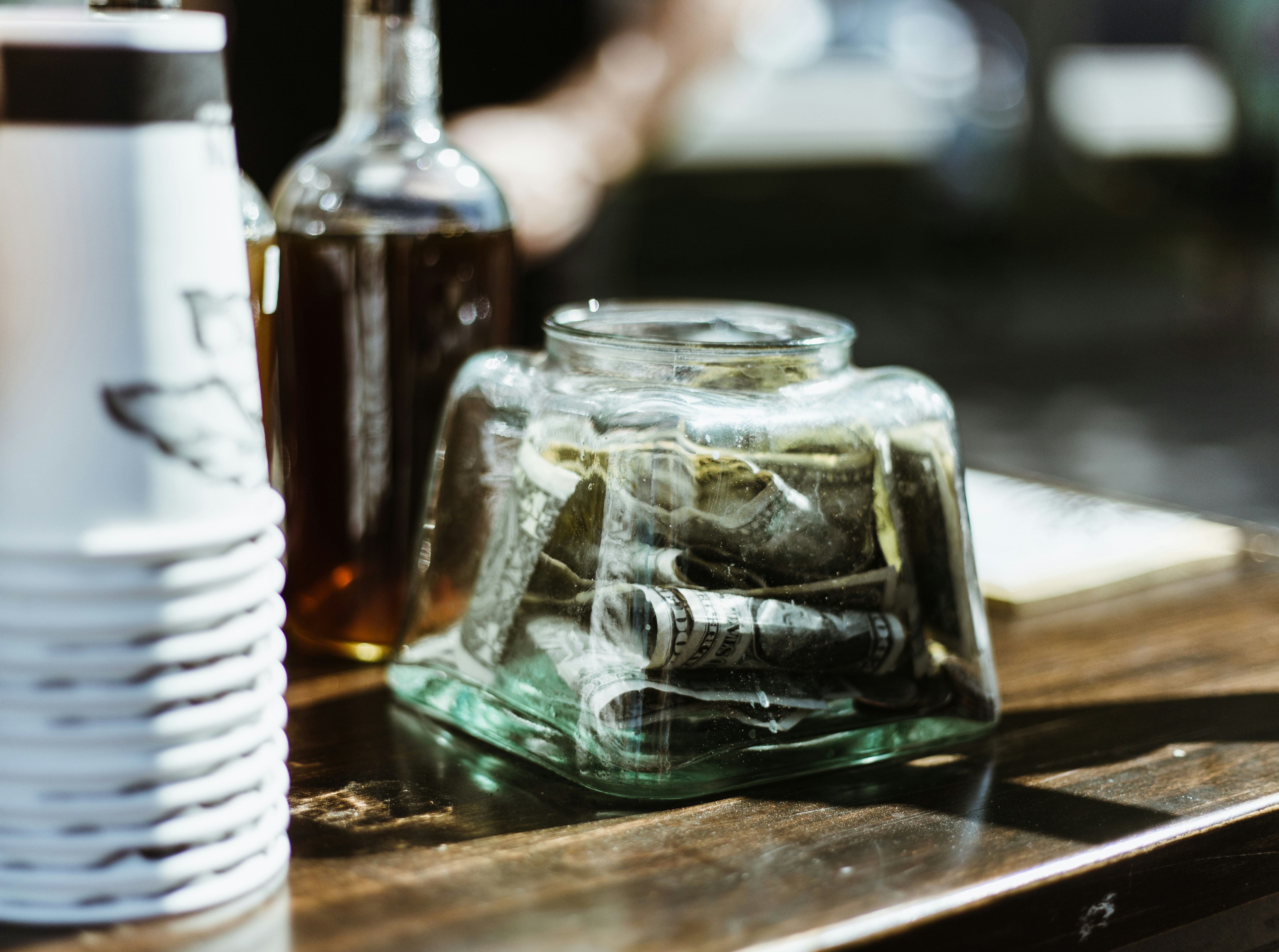 US dollar banknote in jar