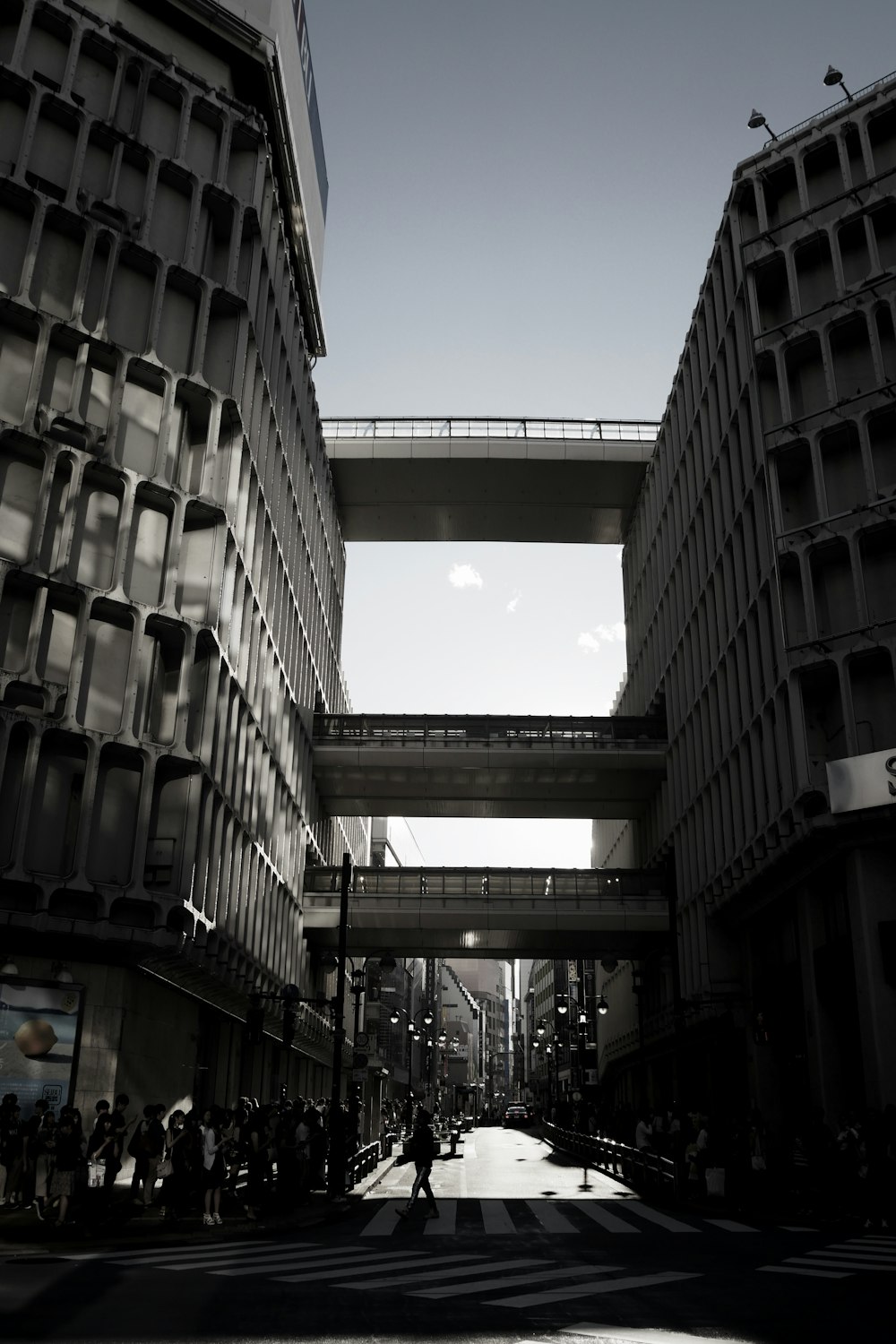 people walking under pass