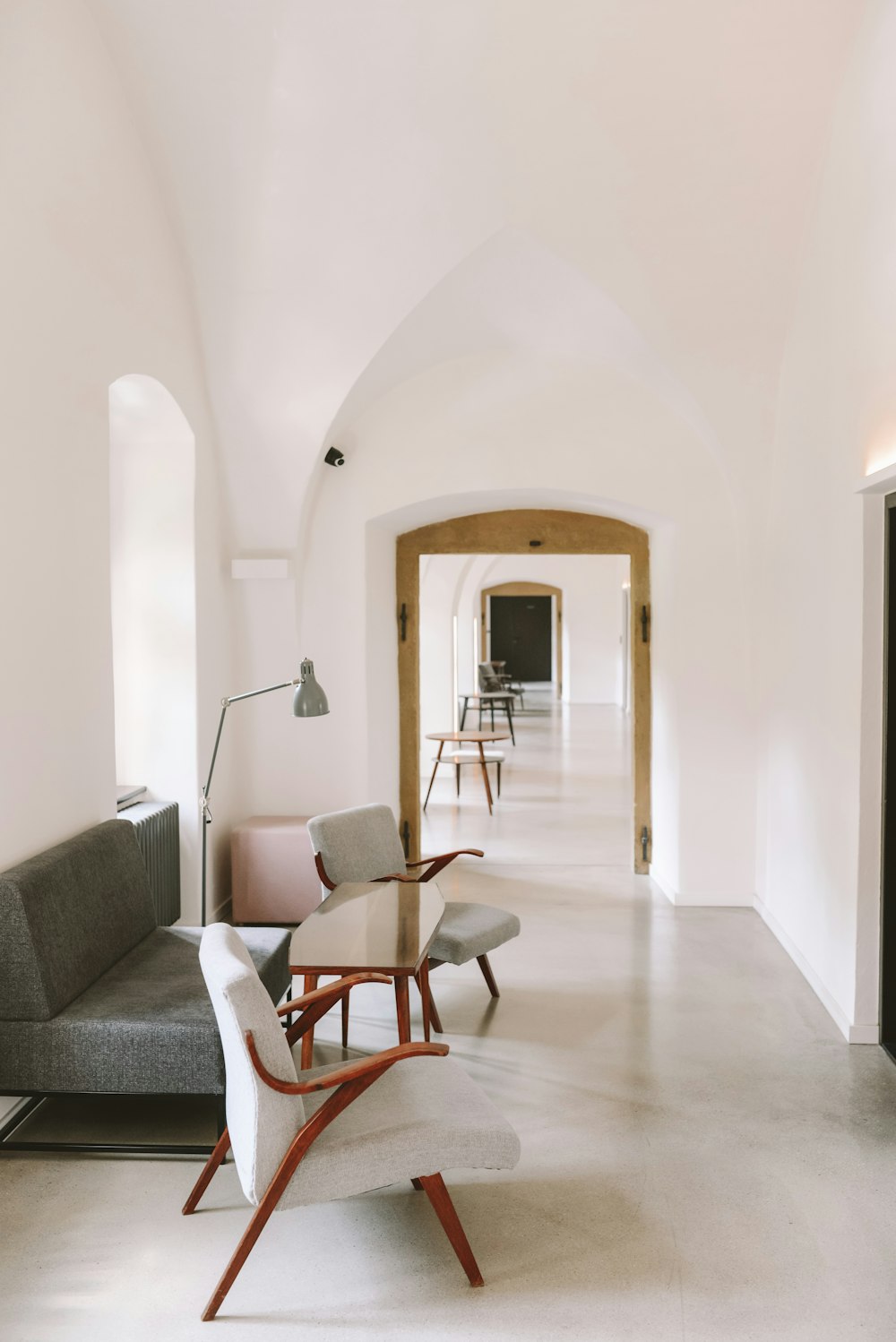 grey and white sofa set at the hallway