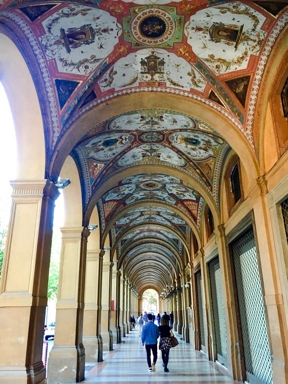 man and woman couple walking in building hallway