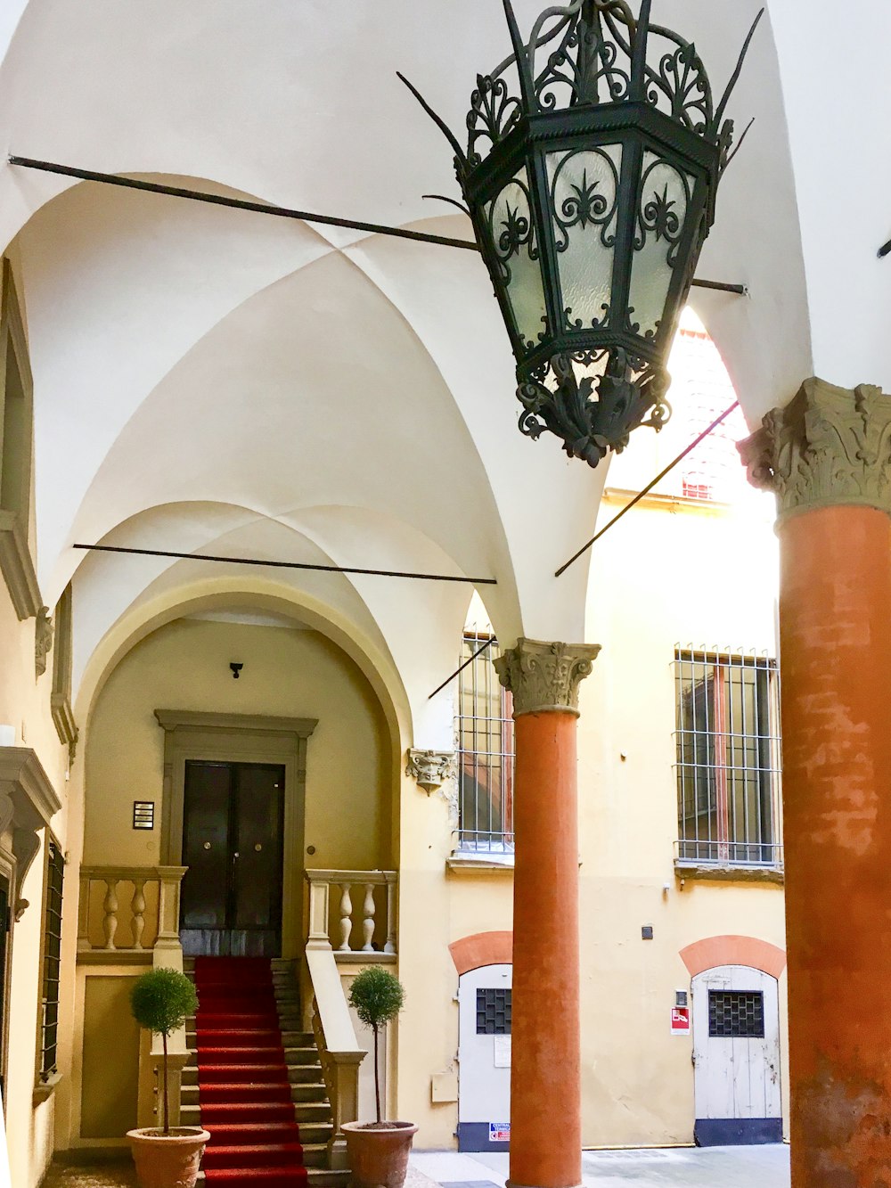 pendant lamp on hallway ceiling in front of stairs