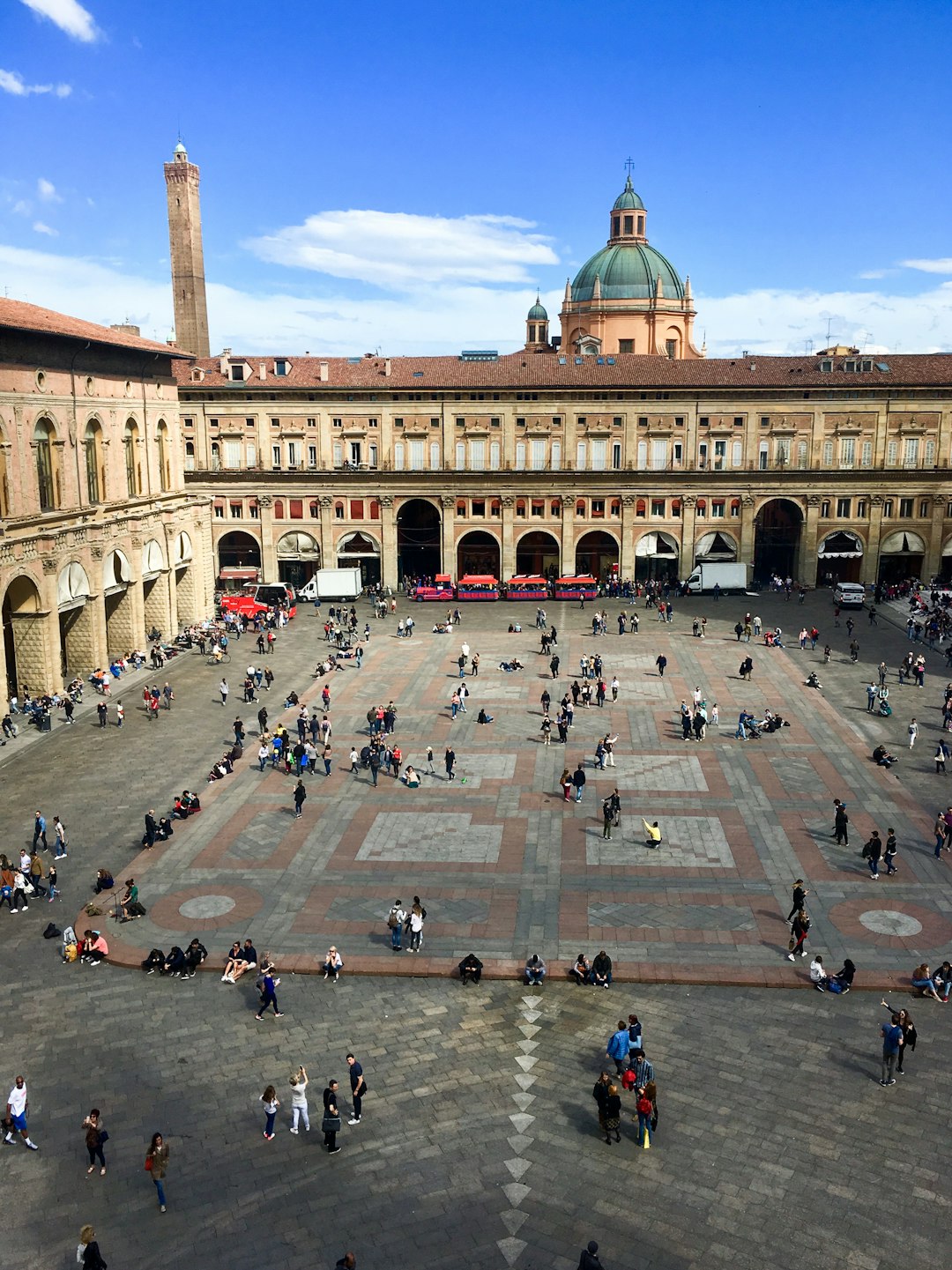  people walking near madrid palace under blue and white skies courtyard forecourt