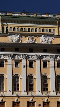 Facade of a commercial building with newly applied decorative plaster in yellow tones