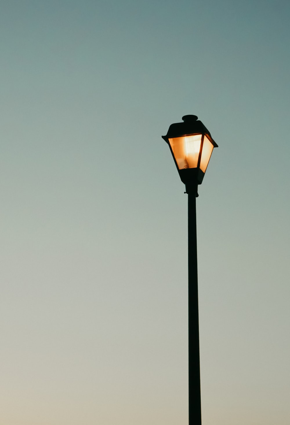 lighted black and orange lamp post