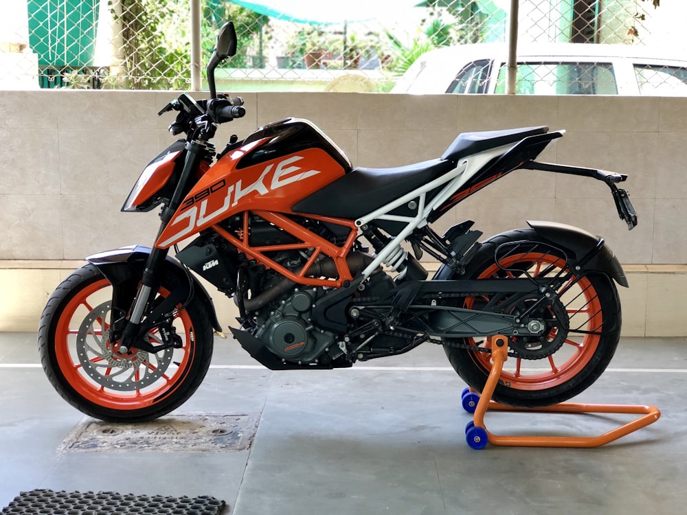 black and orange sports bike