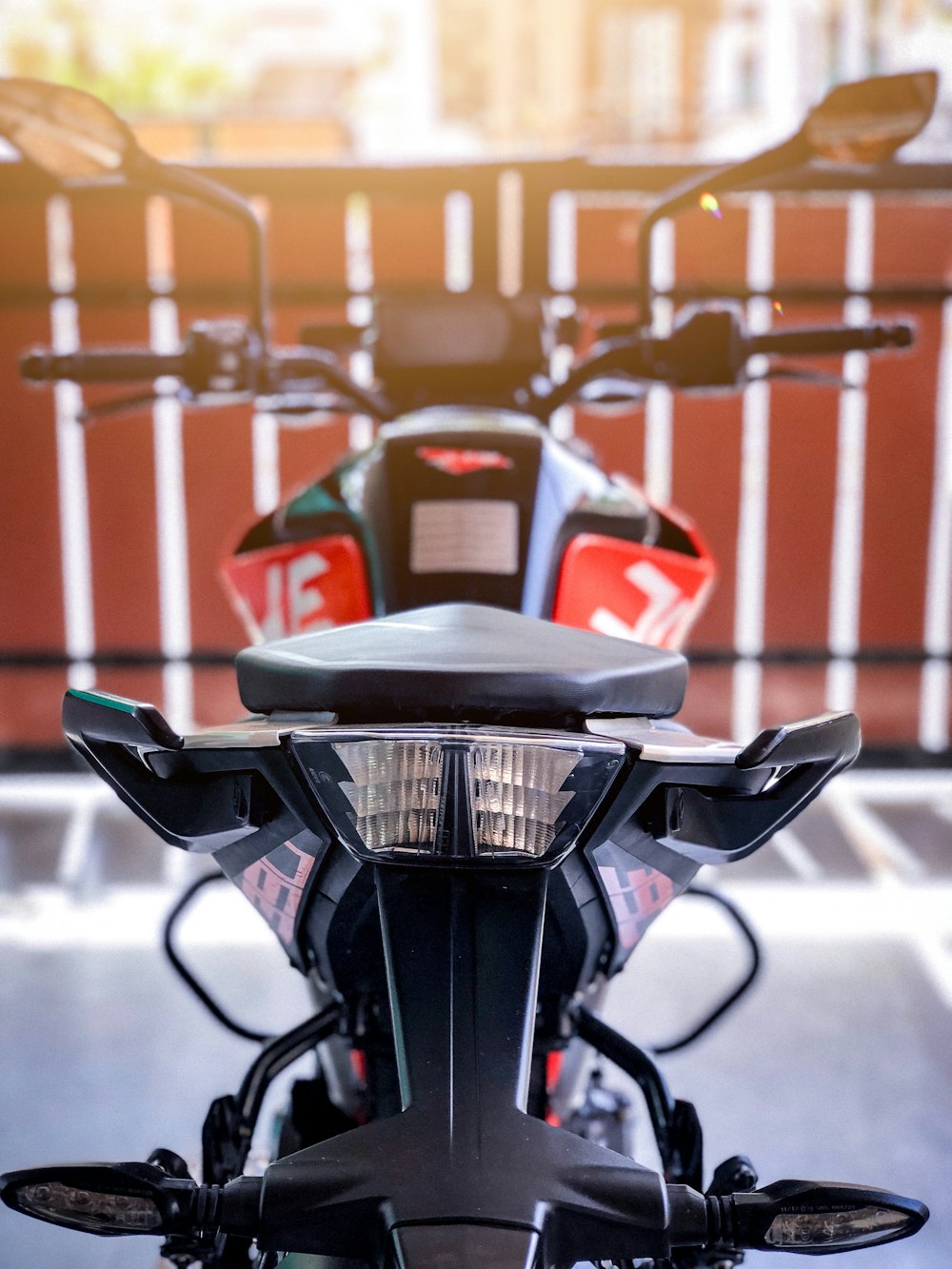 black and red motorcycle near red gate