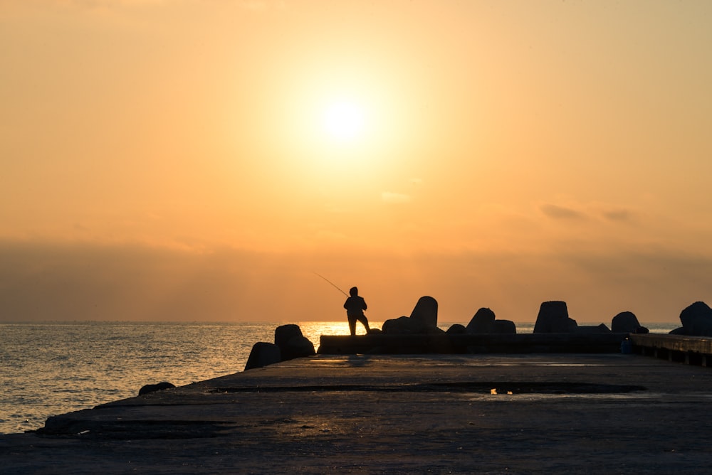 person holding fishing rod