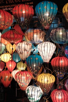 assorted-color lantern lighted in room