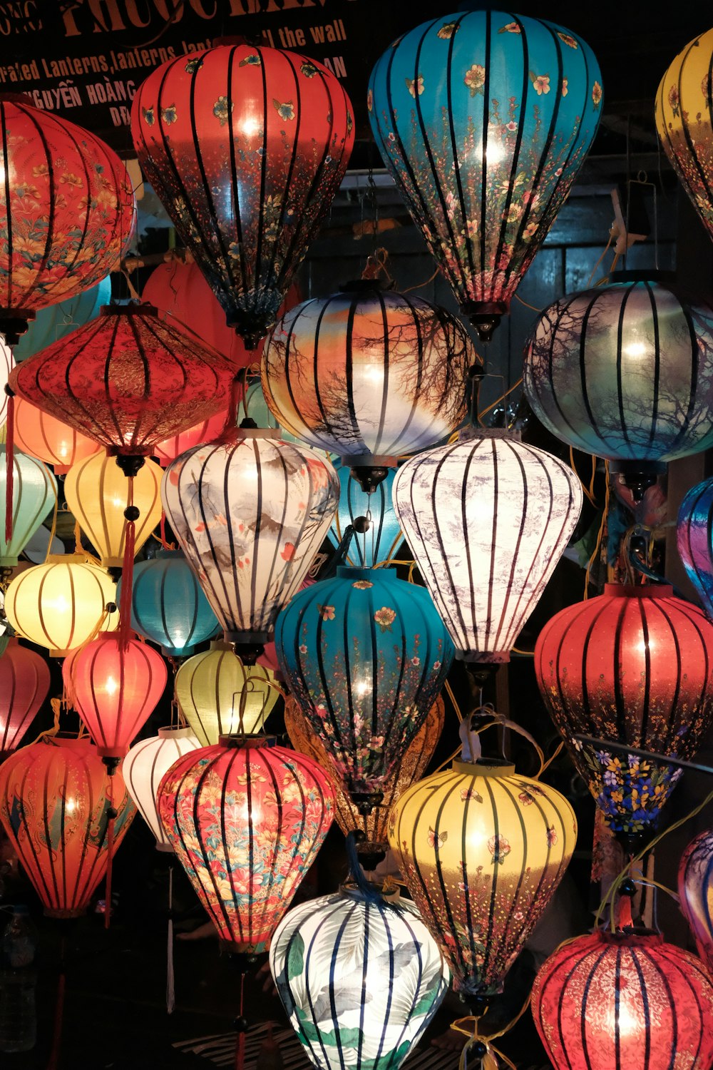 assorted-color lantern lighted in room