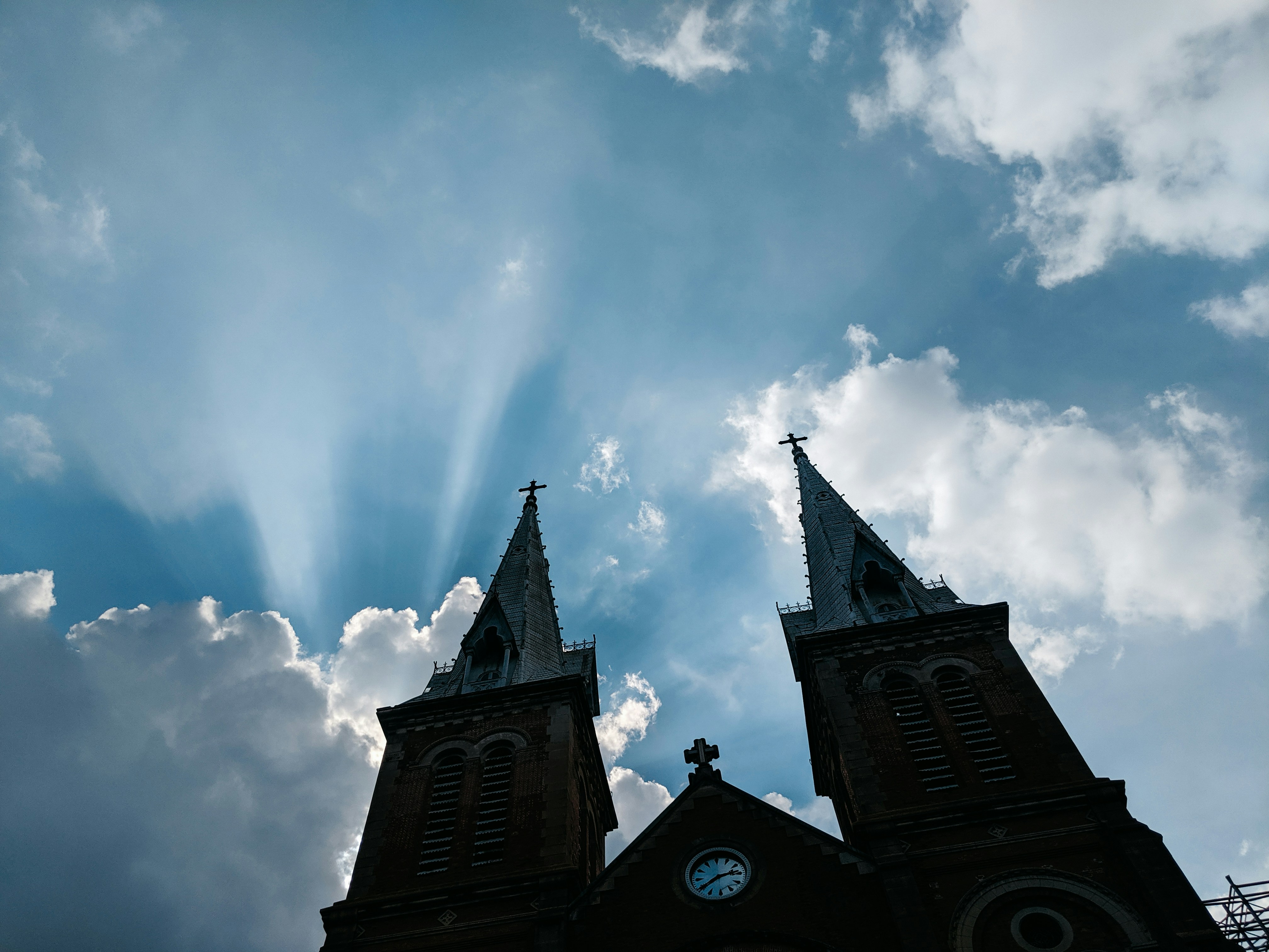 low-angle photo silhouette of cathedral under blue sky