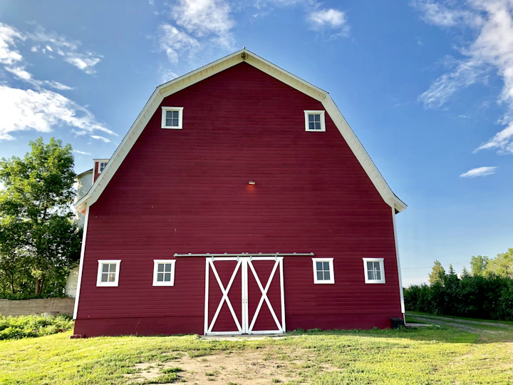Red barn in open farmland perfect for workshop