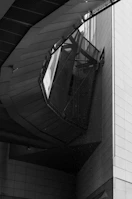 Asymmetrical architectural detail showcasing concrete and steel textures in a luxury remodel.