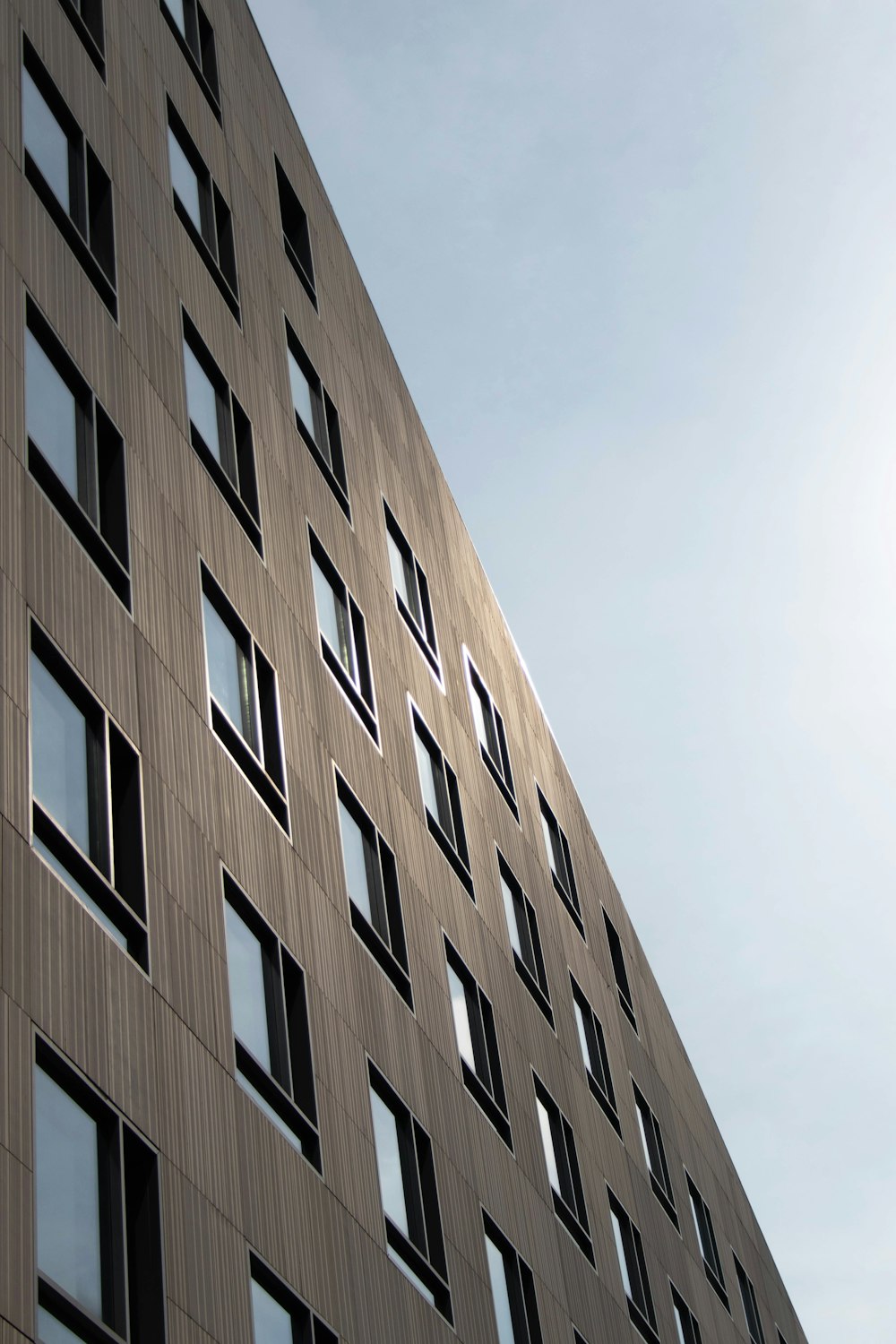 low angle photography of glass curtain building