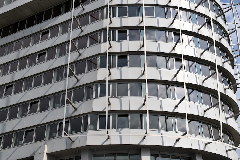 white concrete glass curtain building