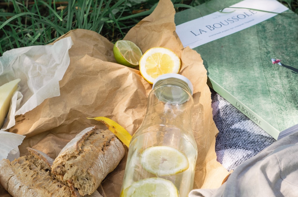 slices of lemon near glass bottle