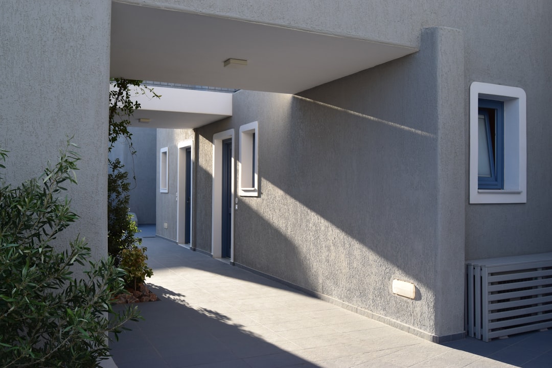 gray cement building, Acroterra Rosa Hotel in Santorini.