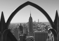 An intricate black and white illustration of a city skyline.