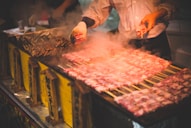 man grilling meat
