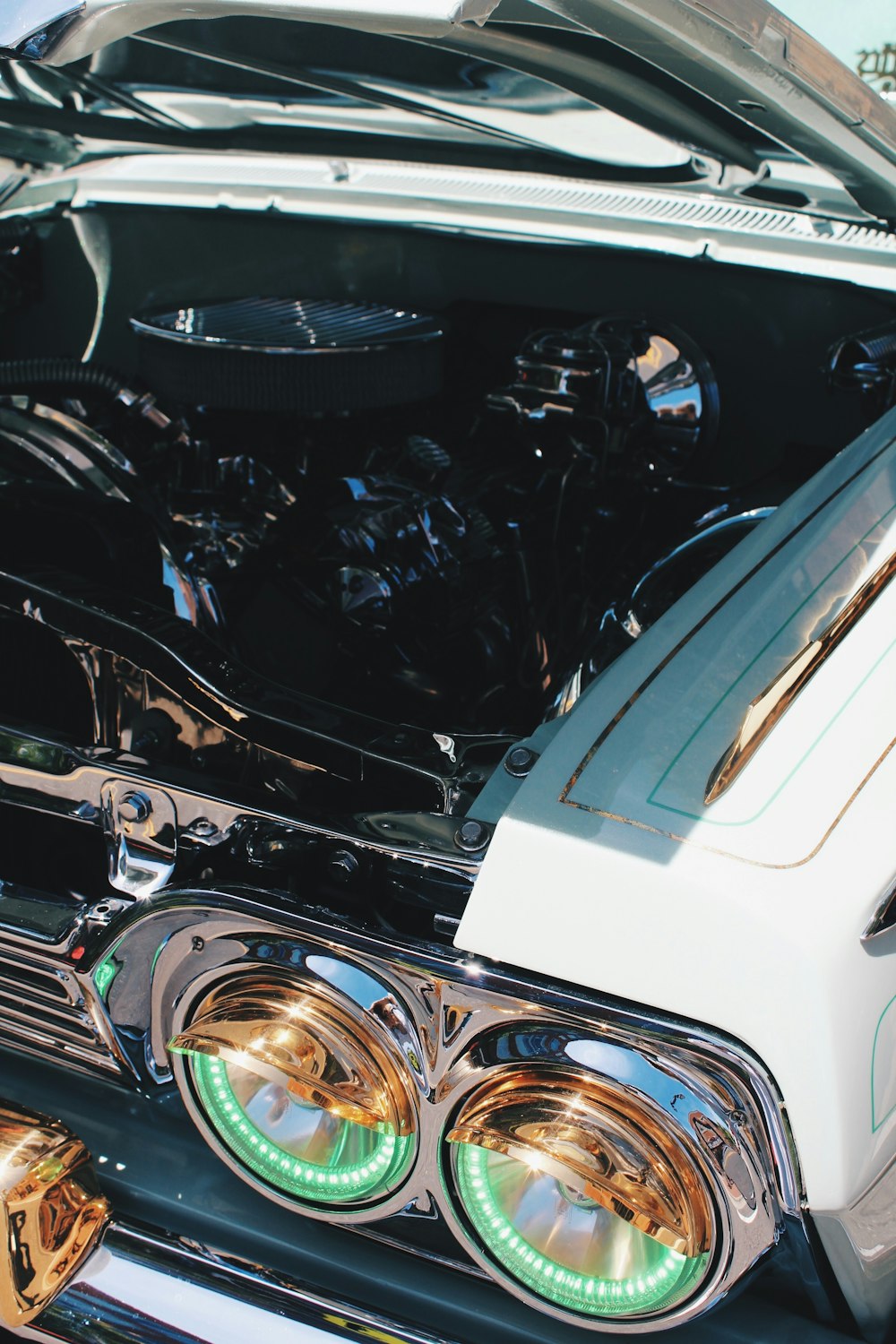 white classic car's chrome plated engine