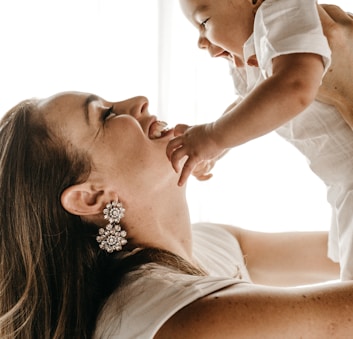 woman holding baby up