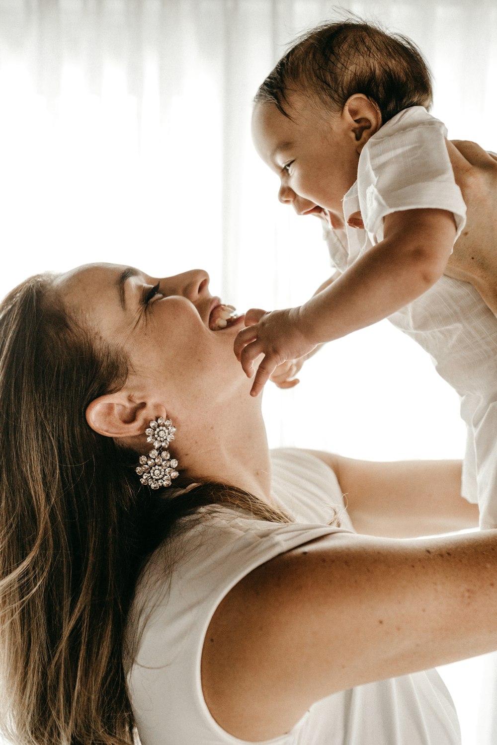 woman holding baby up