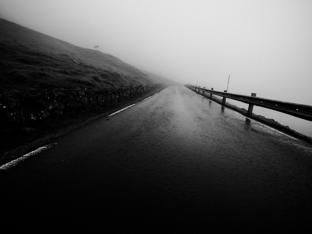 empty road in grayscale photo