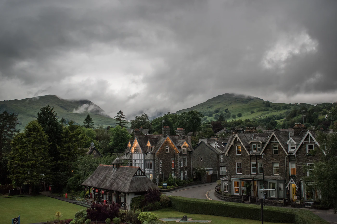 The village of Ambleside among green fells in England's Lake District