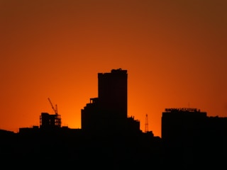 silhouette of buildings during golden hour