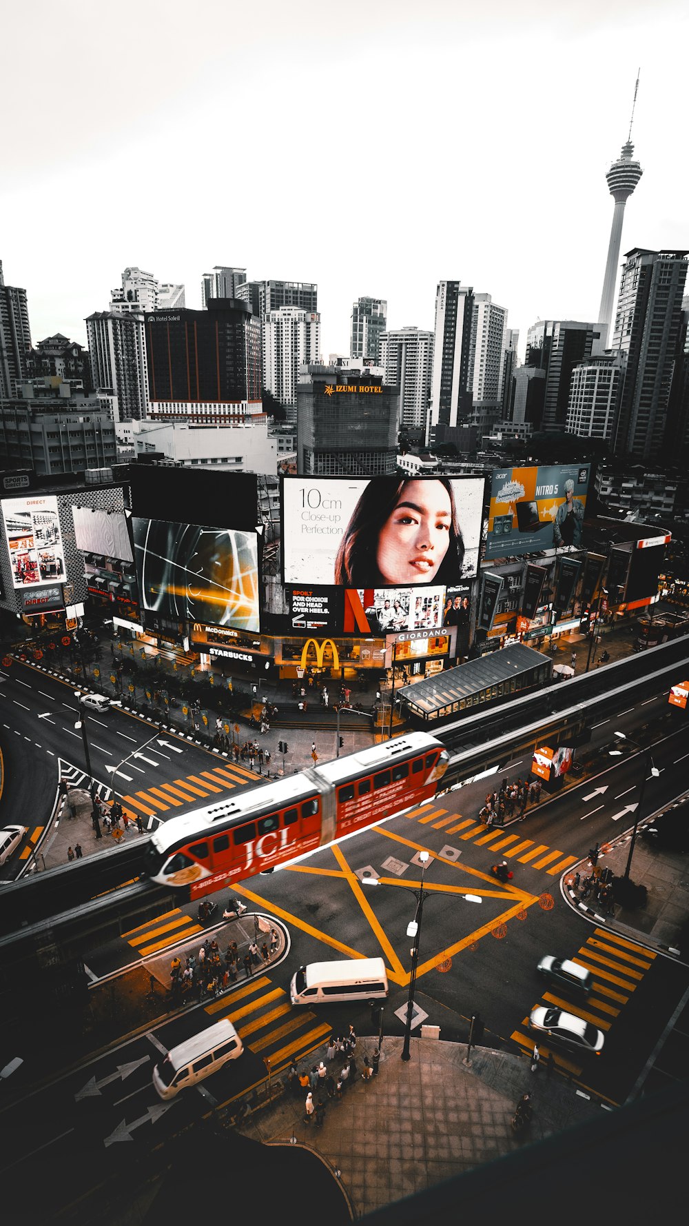 aerial view of buildings with large LED advertisement monitor at the city