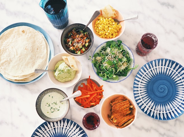 round and blue ceramic bowls and plates