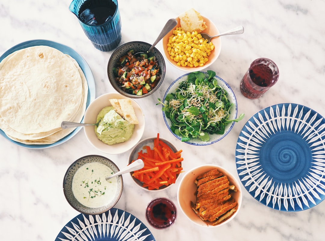 round and blue ceramic bowls and plates, eat tortillas together