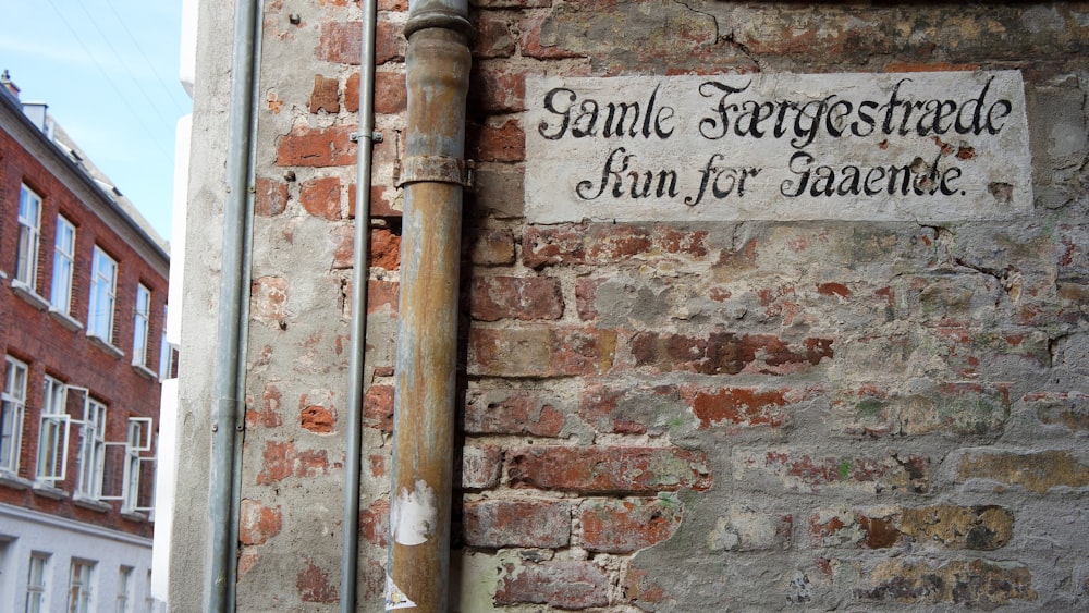 signage painted on wall during daytime