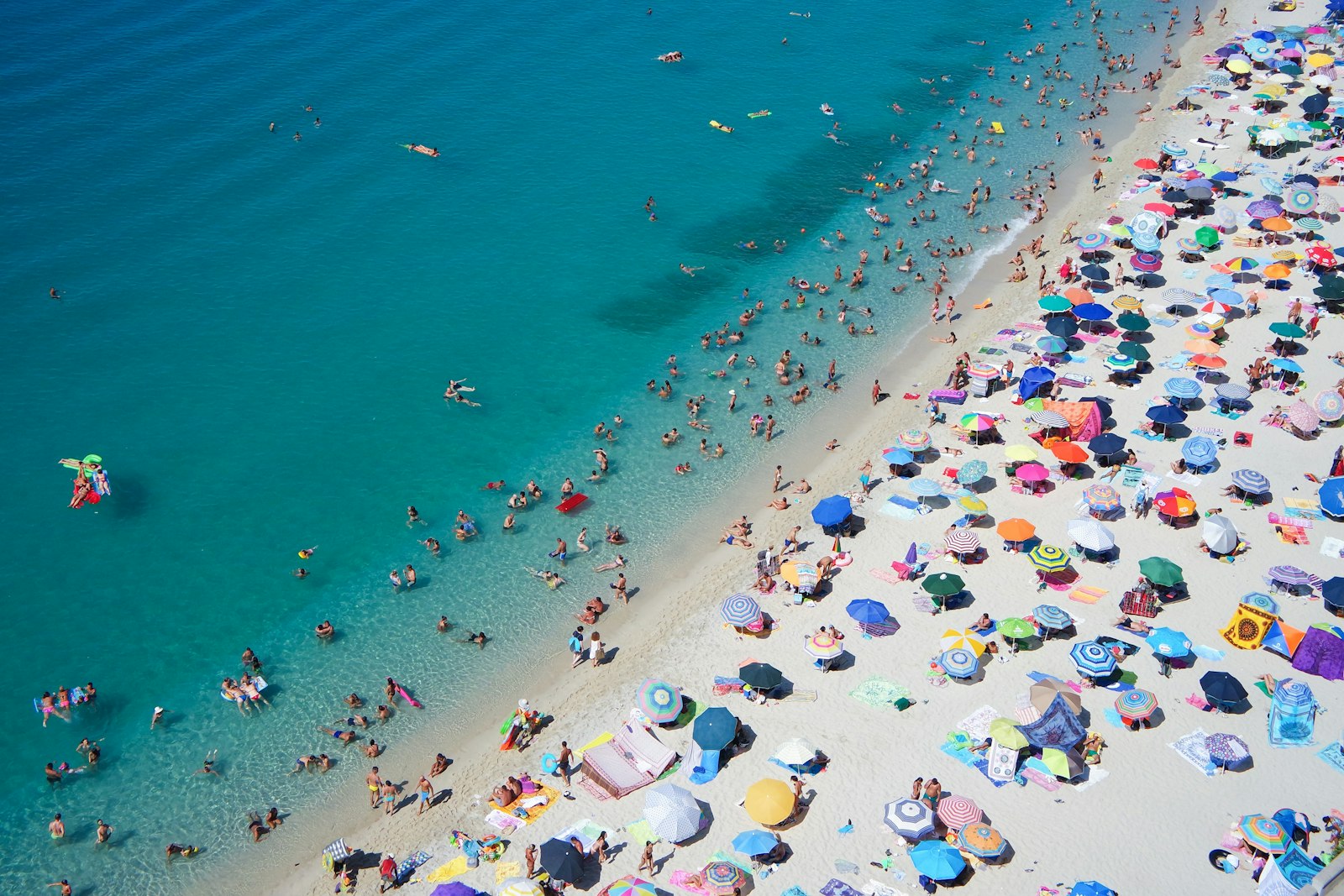 Samsung NX mini sample photo. Group of people swimming photography