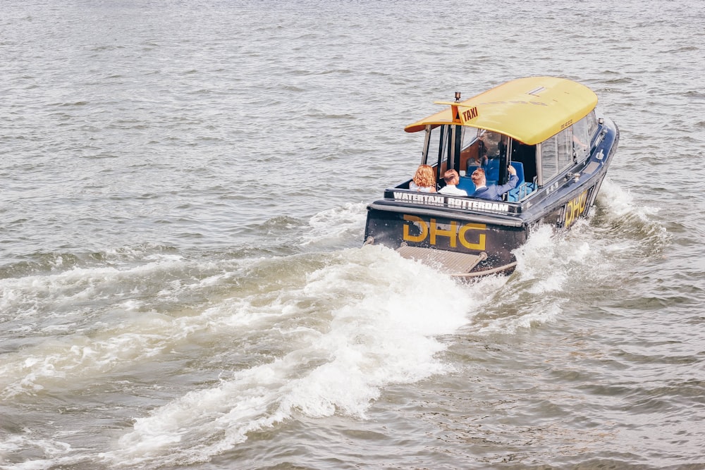 blue and yellow speedboat on body of water