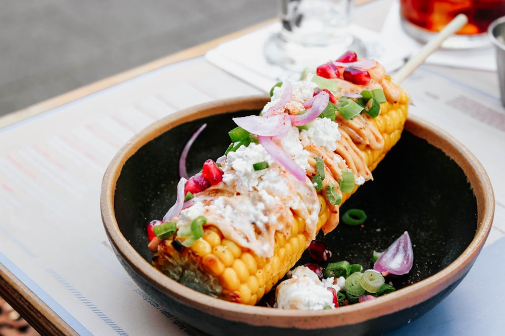 corn cob with stick on bowl