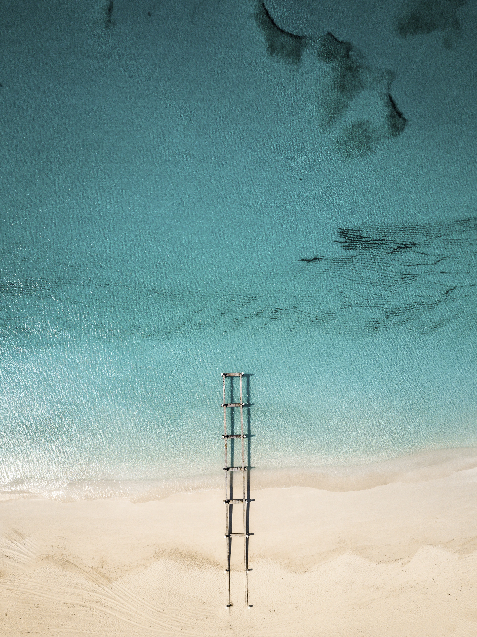 brown frame on seashore during daytime