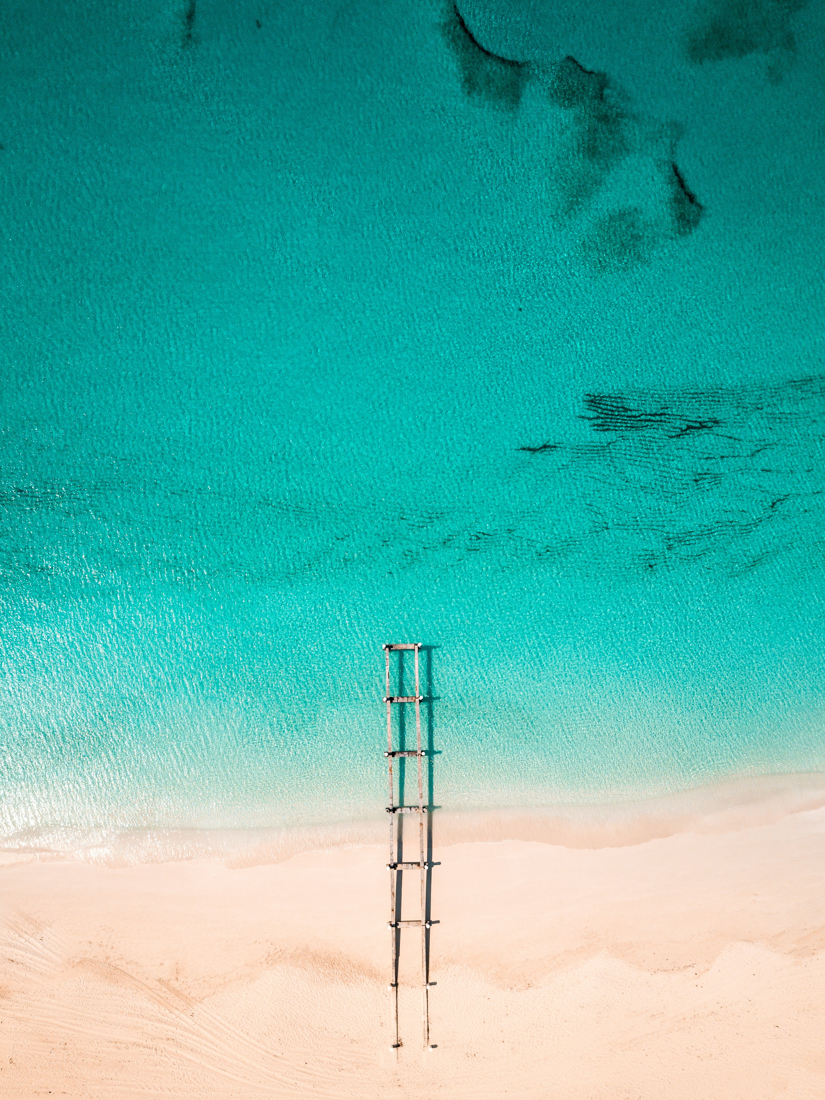 brown frame on seashore during daytime