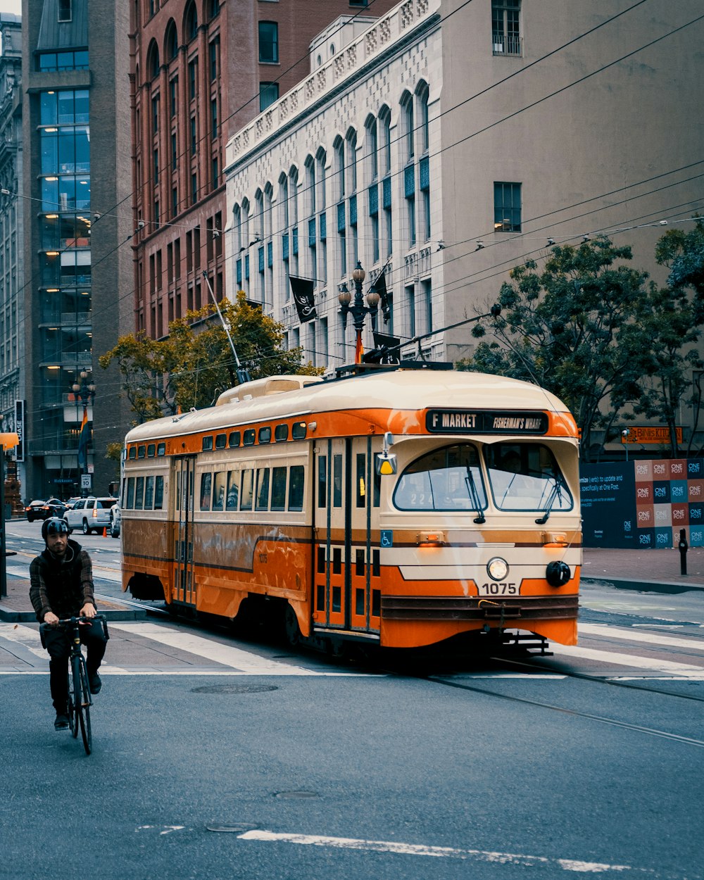 orange bus on road during daytime