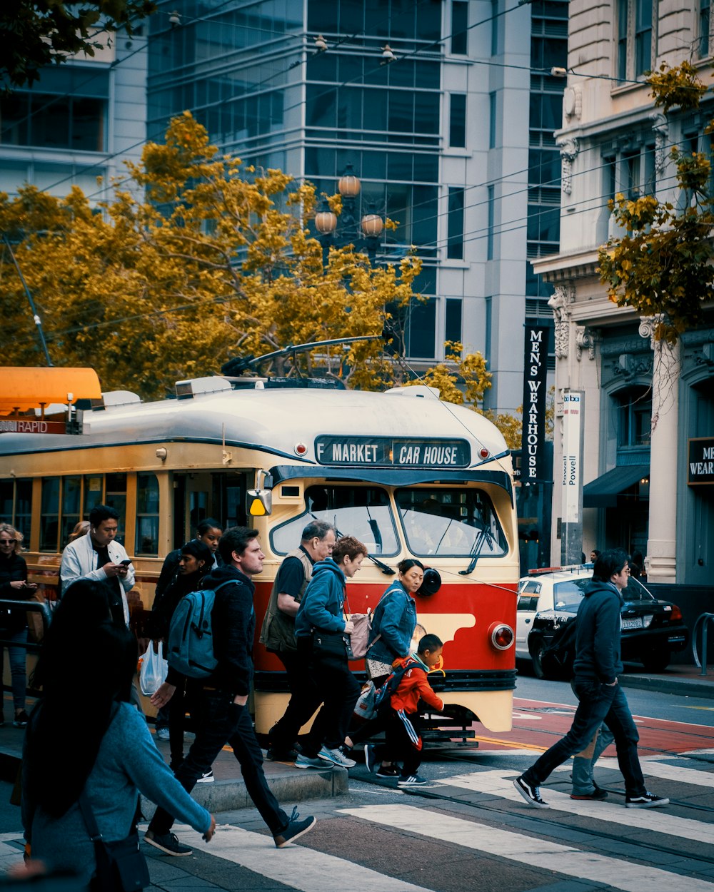 men and women passing by pedestrian lane