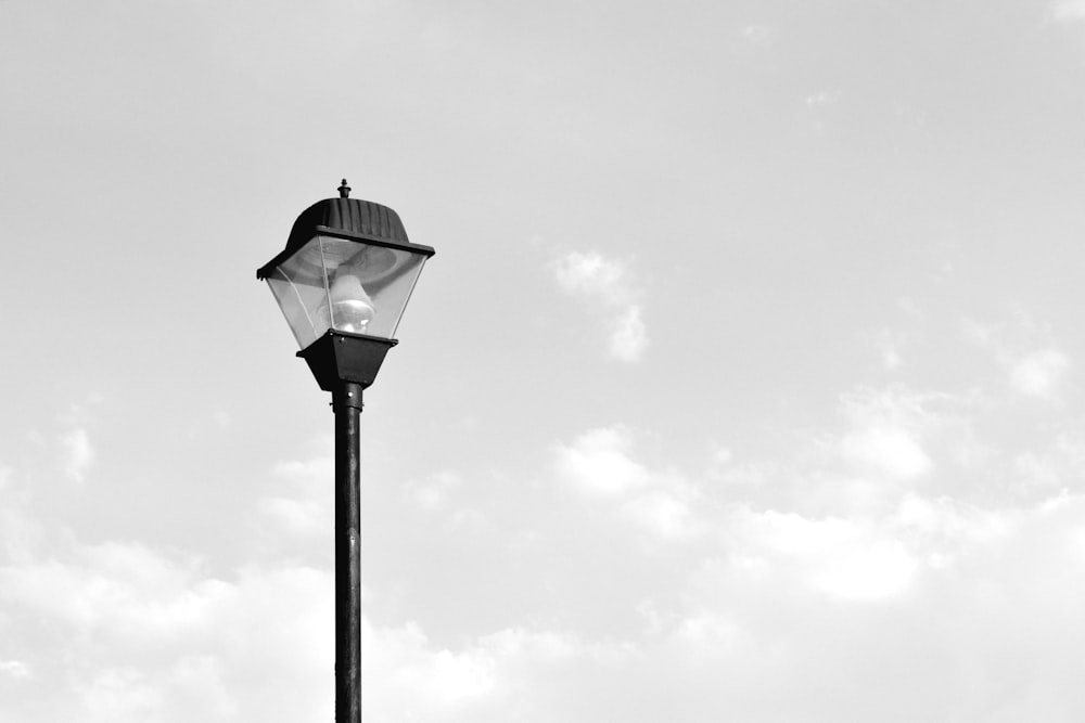 grayscale photo of post lamp