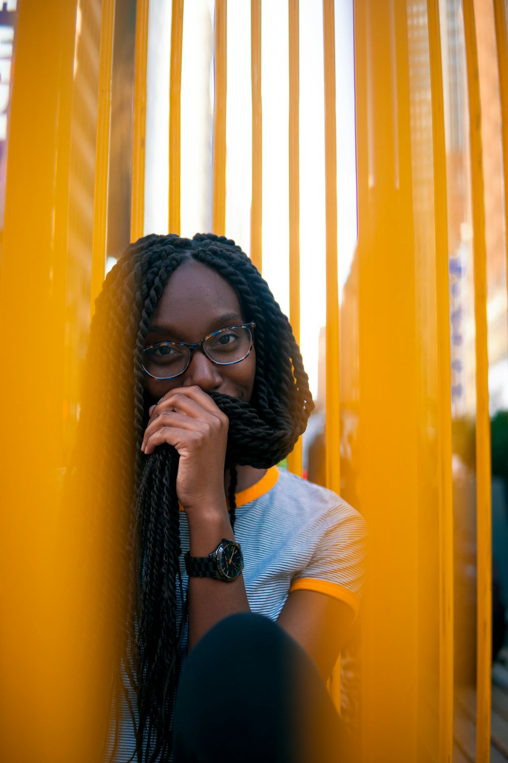 woman sitting on yellow chair