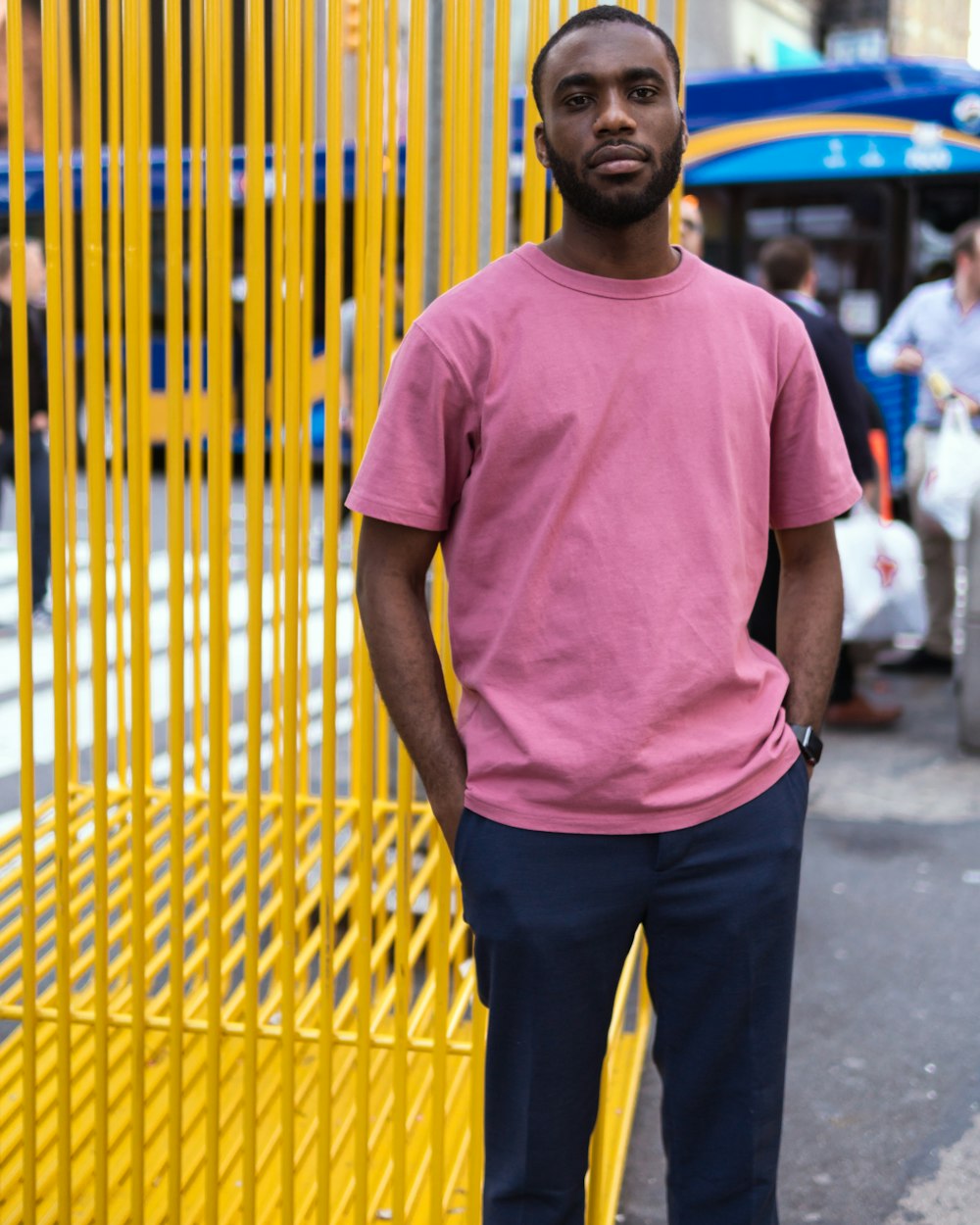man standing while wearing pink t-shirt