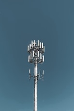 gray steel tower across sky