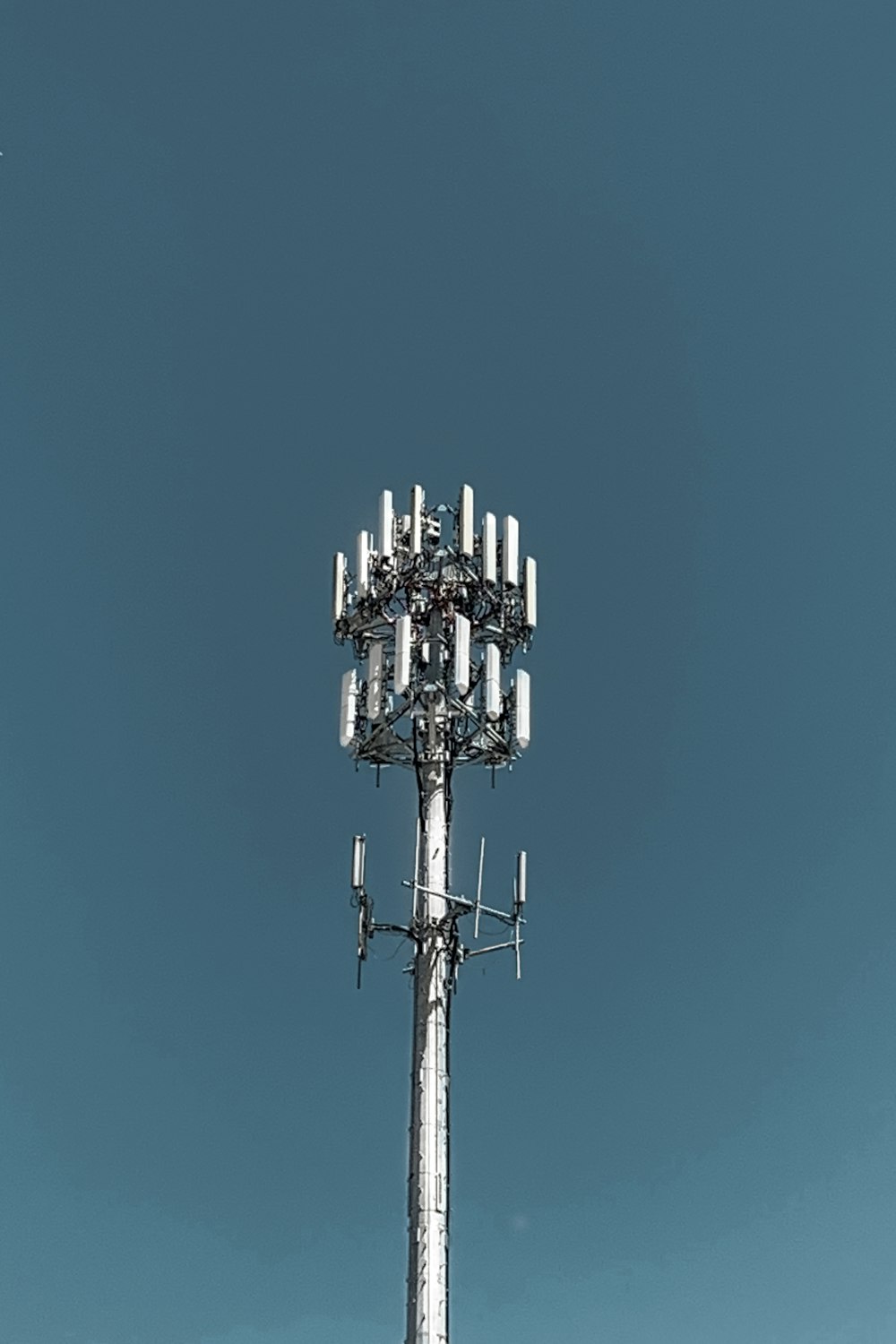 gray steel tower across sky