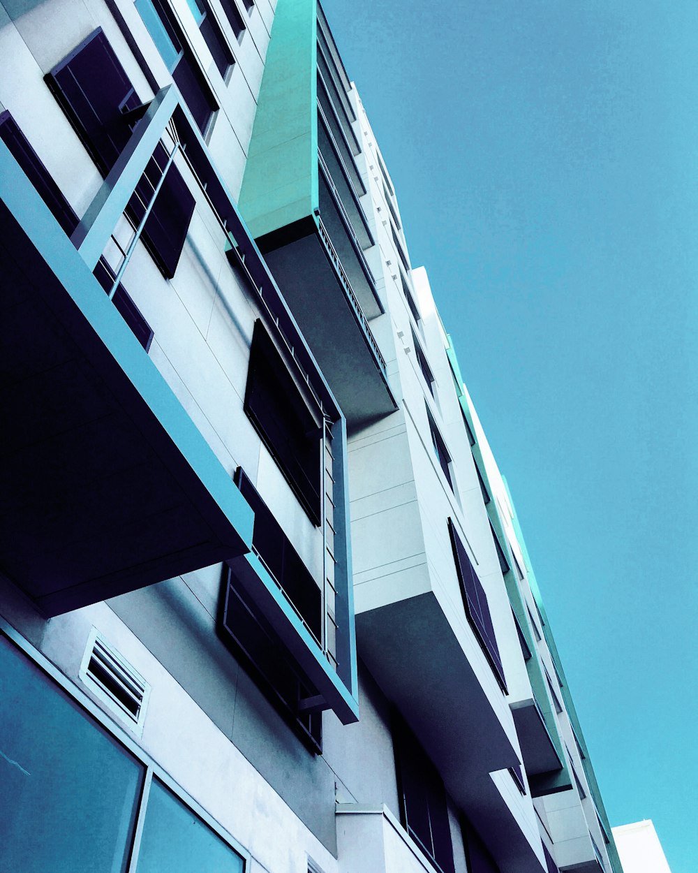 low-angle photography of white concrete building