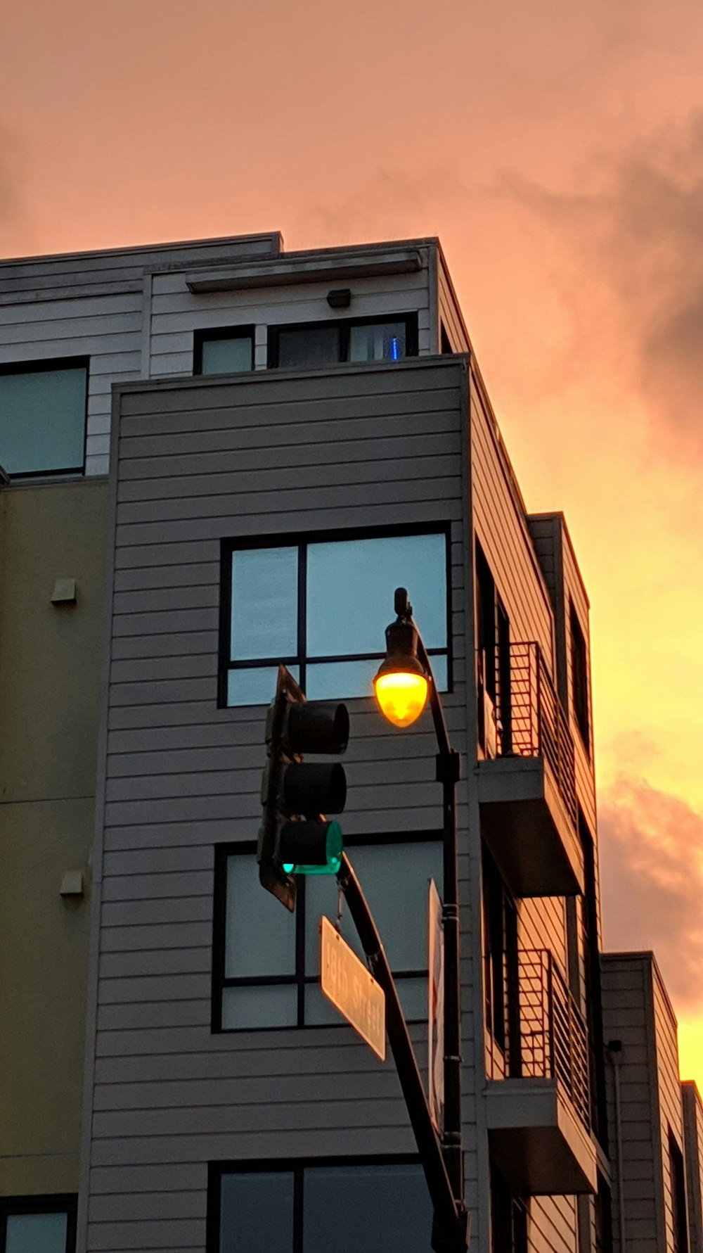 traffic lights near white building