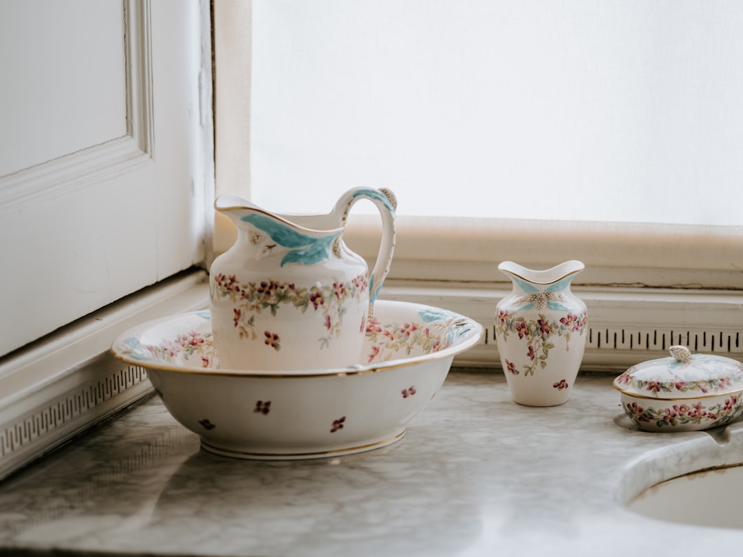 white ceramic pitcher with basin