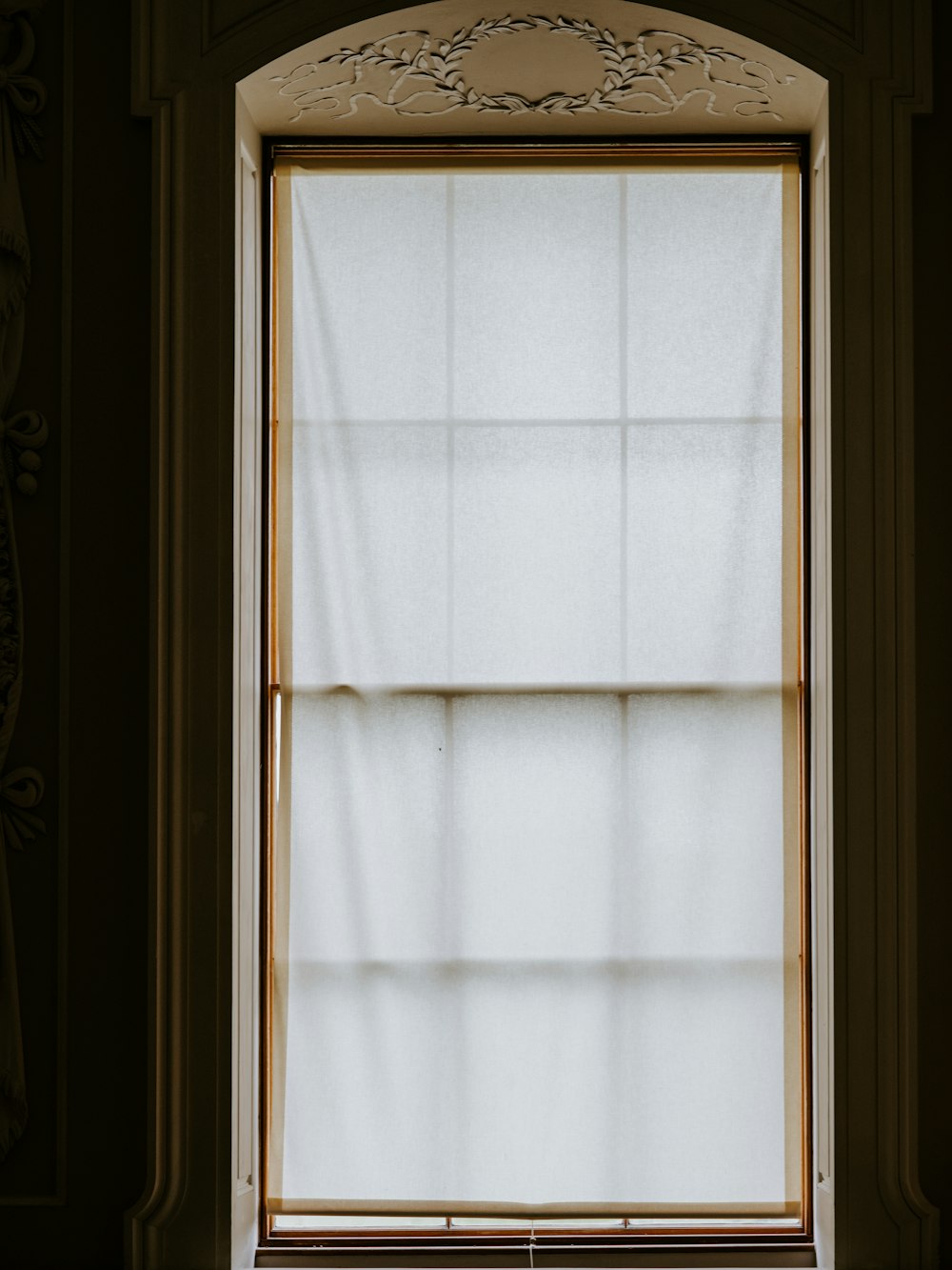 white glass mirror with brown frame